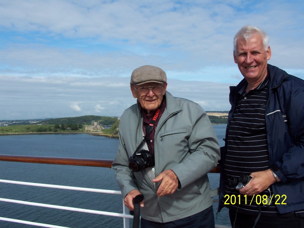Dad and grant with abandoned monastery in background